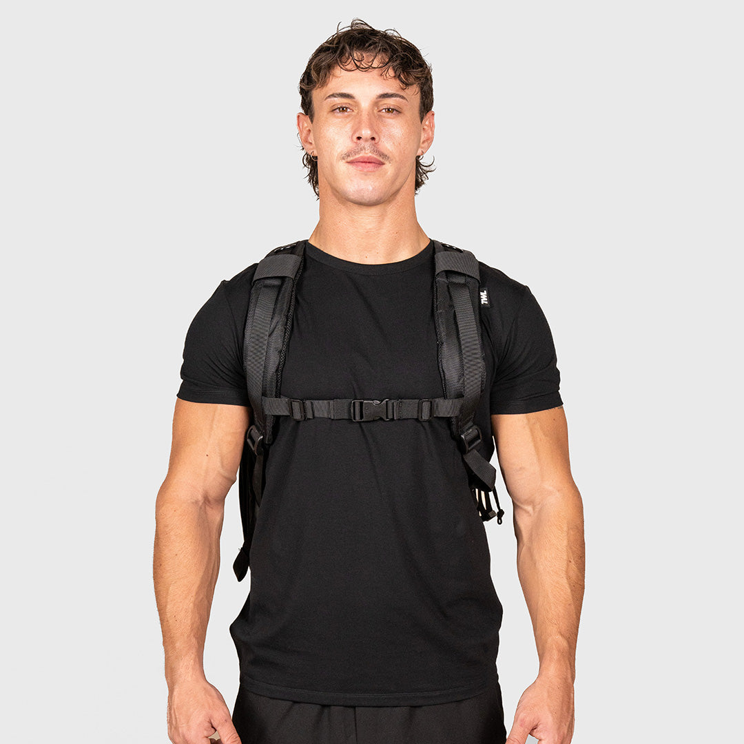 TWL Vanquish Backpack 2.0 50L Black – front view showing shoulder strap on male model