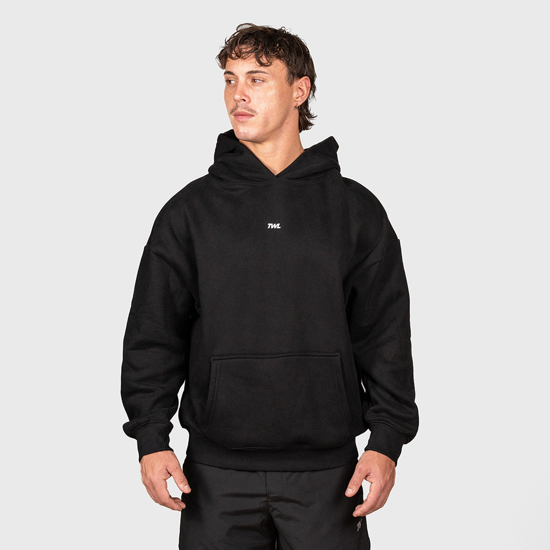 TWL Ascend Hoodie Black – oversized fleece hoodie - front view on male model