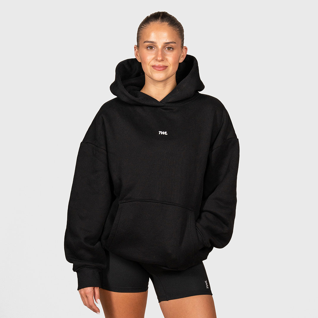 TWL Ascend Hoodie Black – oversized fleece hoodie - front view on female model