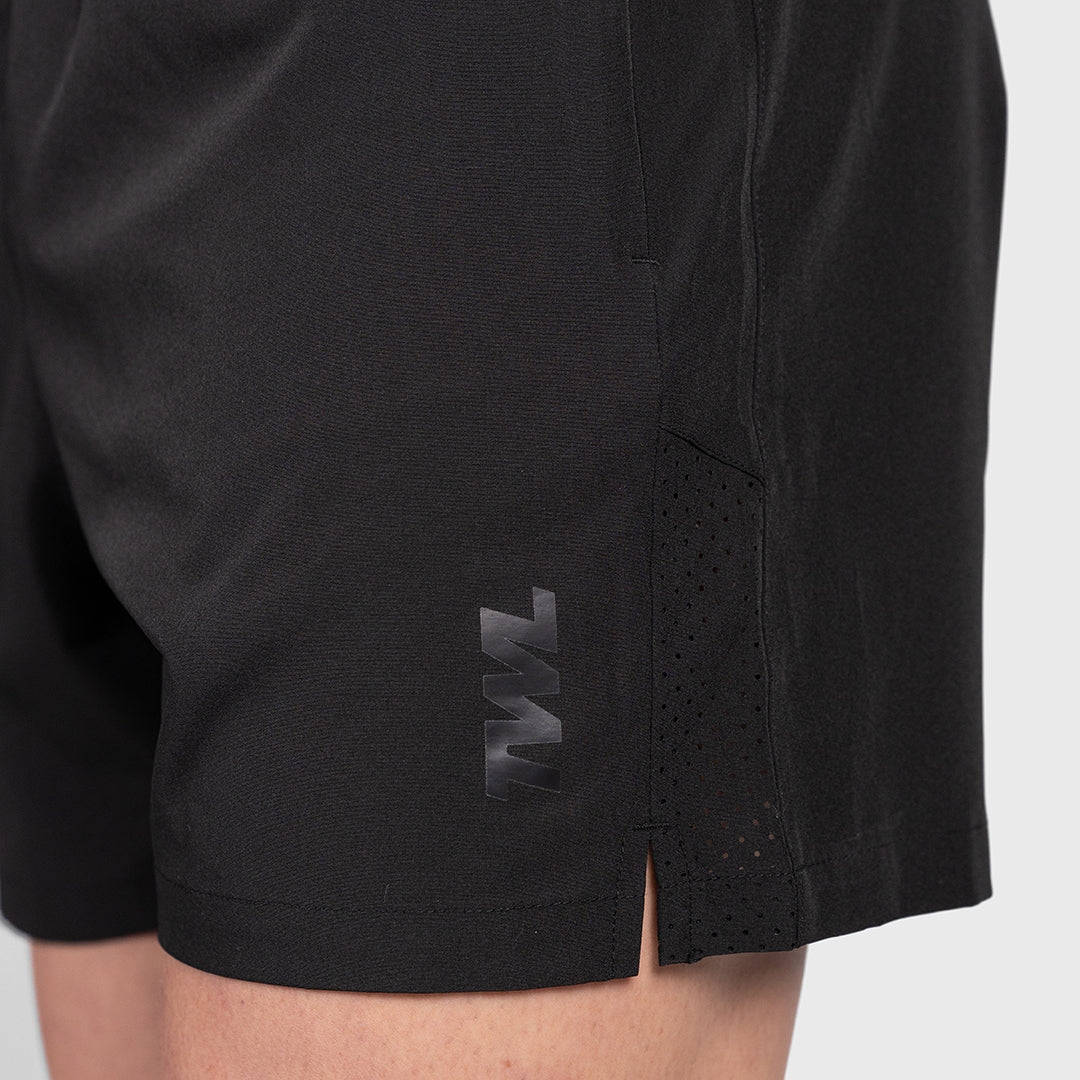 Macro detail of the side split seam and ventilation holes on the TWL Men's Rep Shorts 5" in Blackout