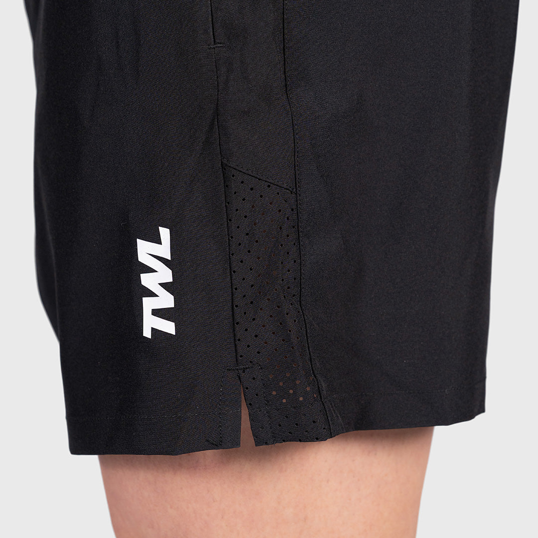 Macro detail of the side split seam and ventilation holes on the TWL Men's Rep Shorts 5"