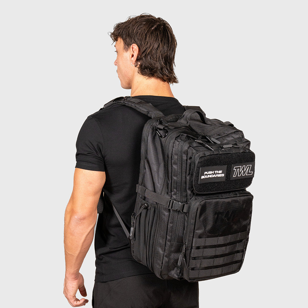 TWL Vanquish Backpack 2.0 50L Black – on male models back fully loaded.